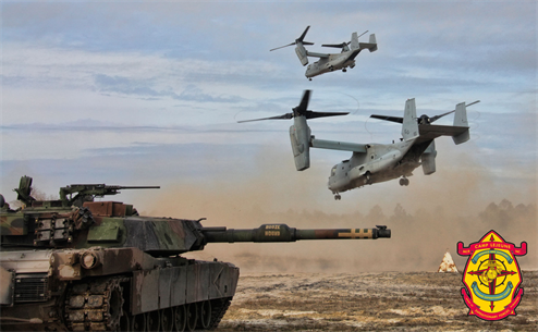 MARINE CORPS BASE CAMP LEJEUNE, N.C. - MV-22B Ospreys from Marine Medium Tilt Rotor Squadron 263 (Reinforced), 22nd Marine Expeditionary Unit, evacuate a hypothetical casualty while an M1A1 Abrams tank with Battalion Landing Team, 2nd Battalion, 2nd Marine Regiment, 22nd MEU, provides security during a mechanized raid exercise aboard Marine Corps Base Camp Lejeune, N.C.