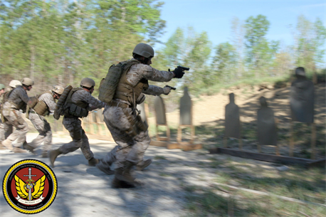 MARINE CORPS BASE CAMP LEJEUNE, N.C. - Students slaughter a row of paper targets during a pistol qualification exercise aboard Camp Lejeune, N.C. The students used 9 mm pistols, M4 assault rifles, and precision rifles during the course.